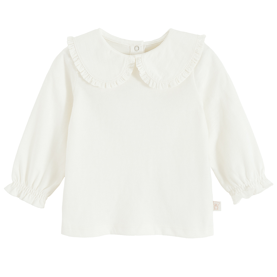 White long sleeve blouse with round collar and elastic around wrists