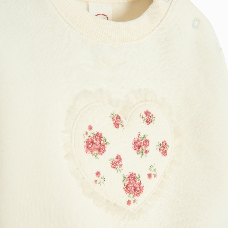 White sweatshirt with a heart print and burgundy leggings and headband