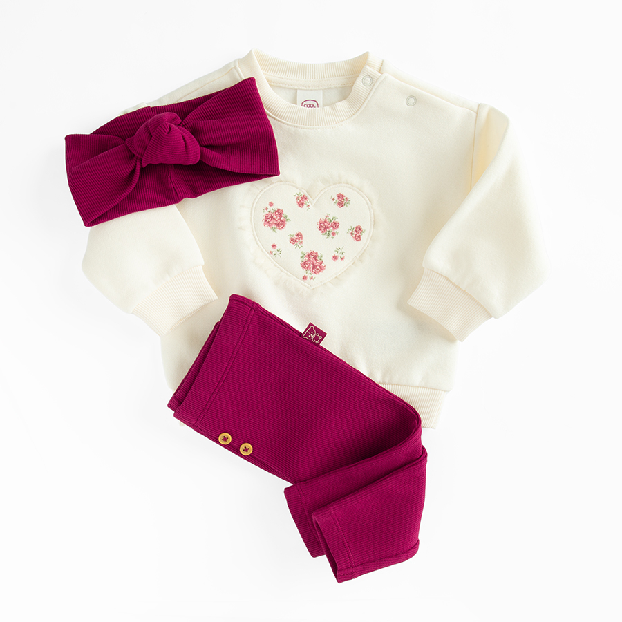 White sweatshirt with a heart print and burgundy leggings and headband