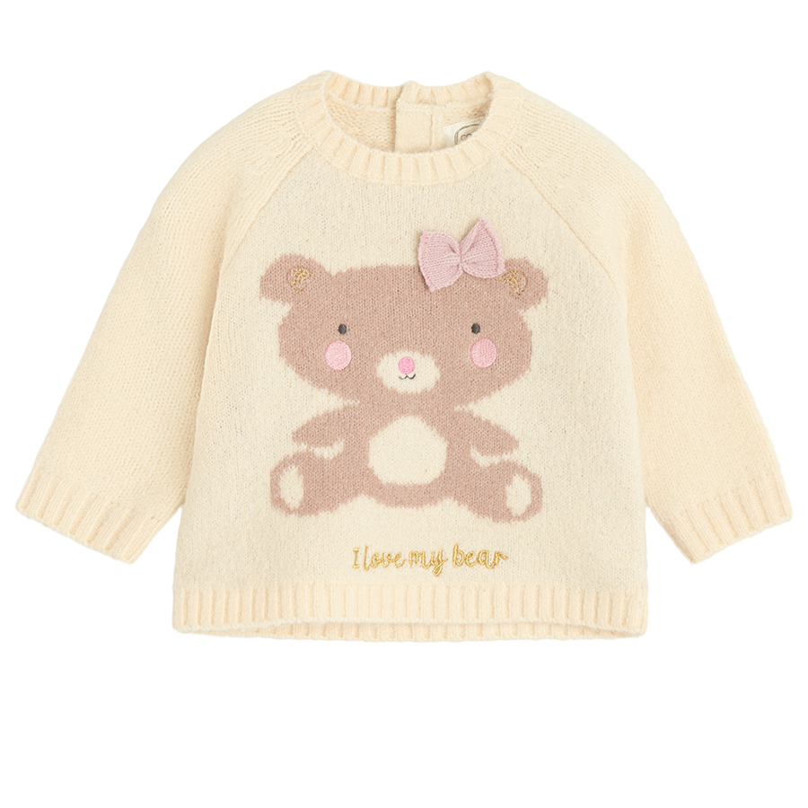 Ecru sweater withbear print and ruffle on the bottom