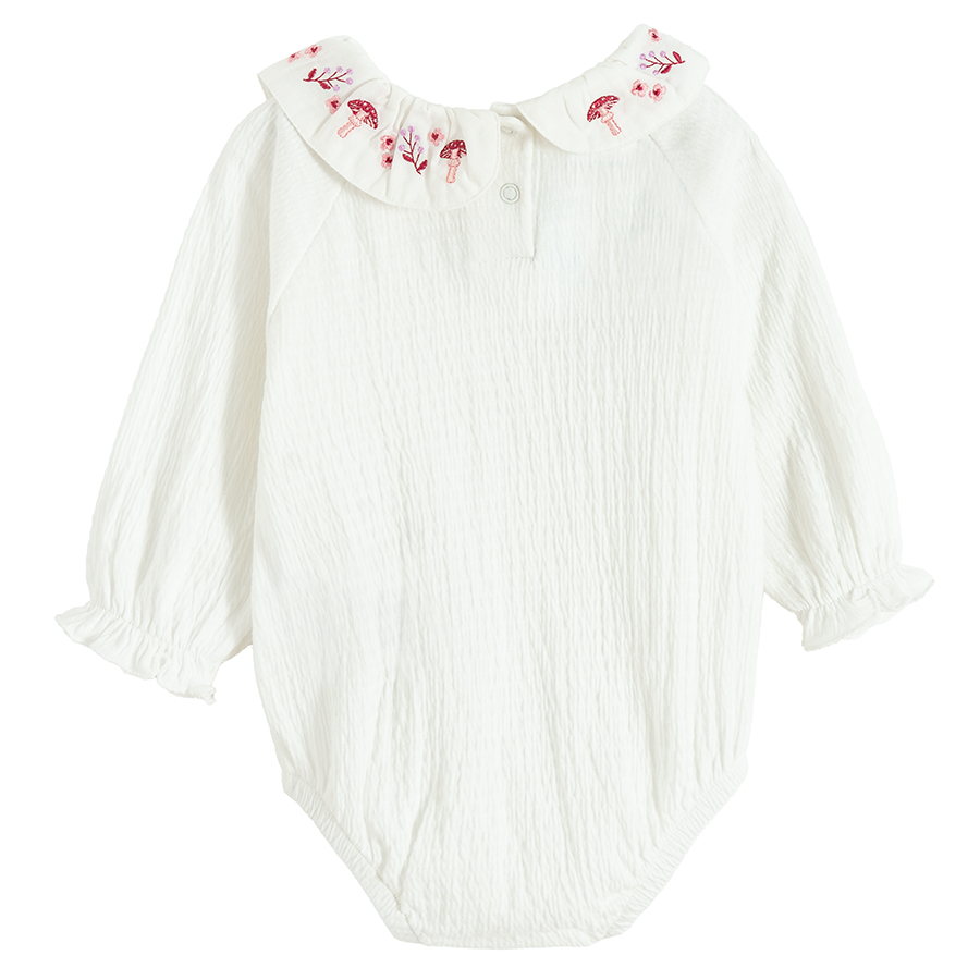 White long sleeve body suit with embroidery on the collar neck