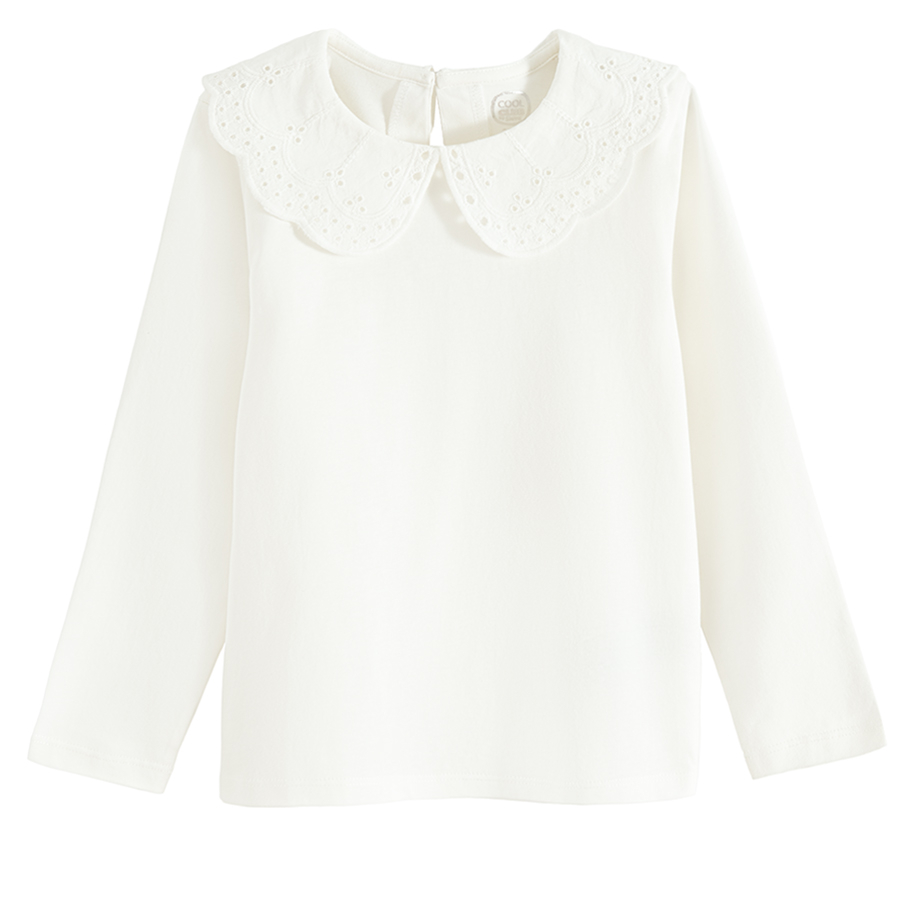 White long sleeve blouse with ruffle on the neckline