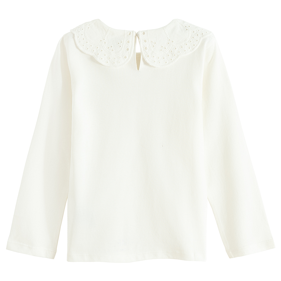 White long sleeve blouse with ruffle on the neckline