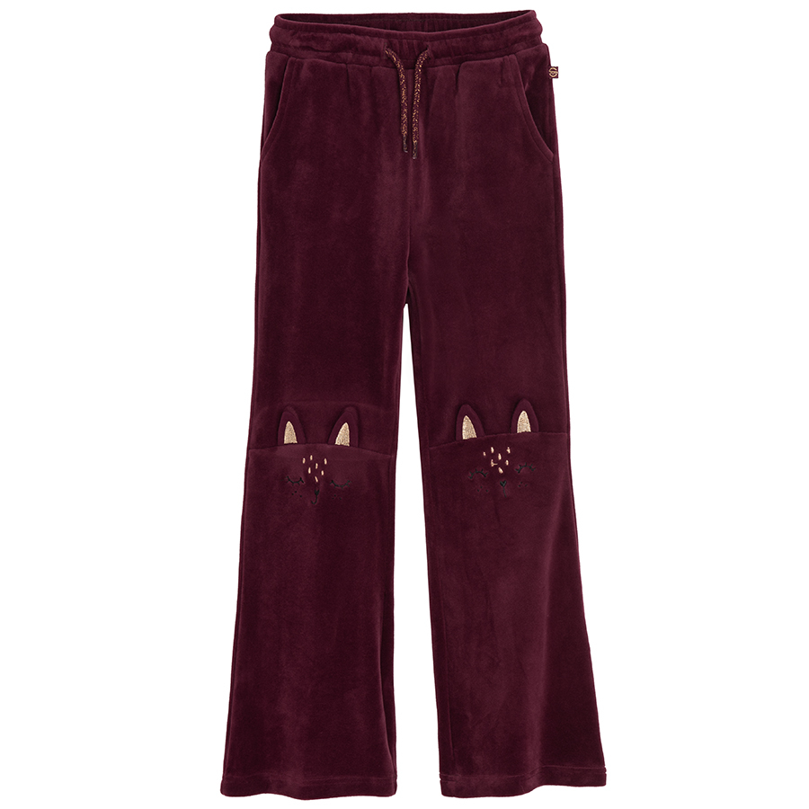 Burgundy jogging pants with kitten on knees