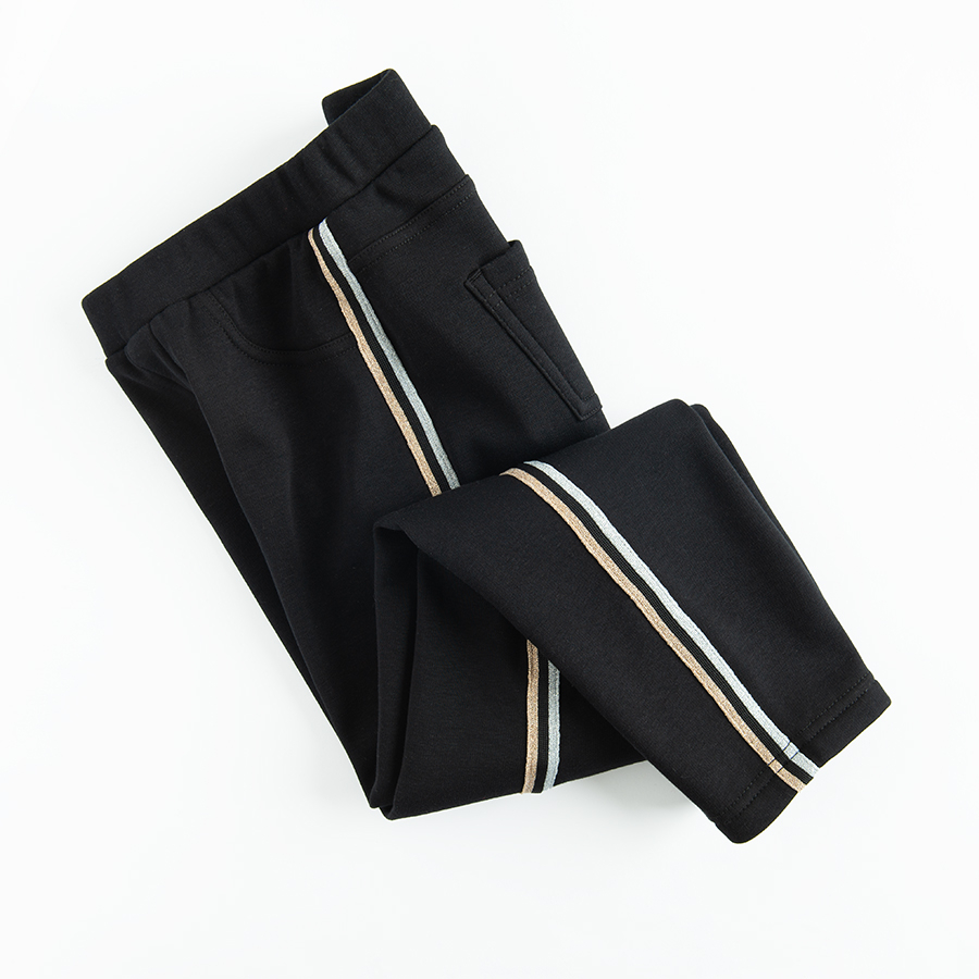 Black leggings with gold side stripe