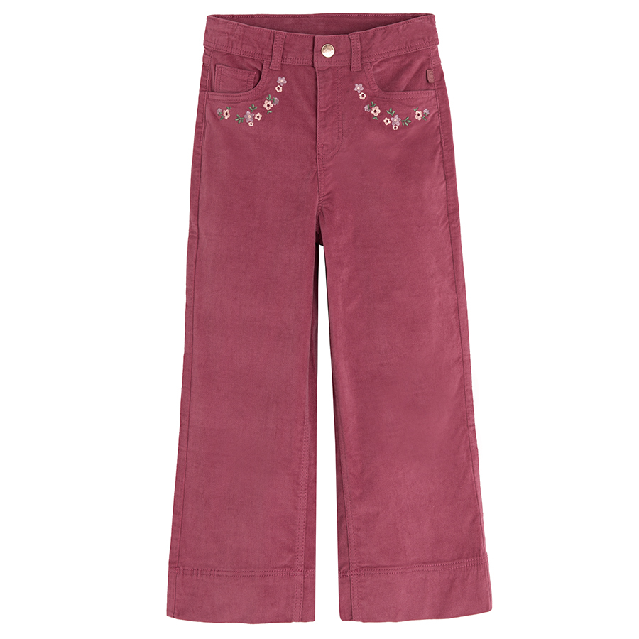 Burgundy trousers with flowers embroidered around the pockets