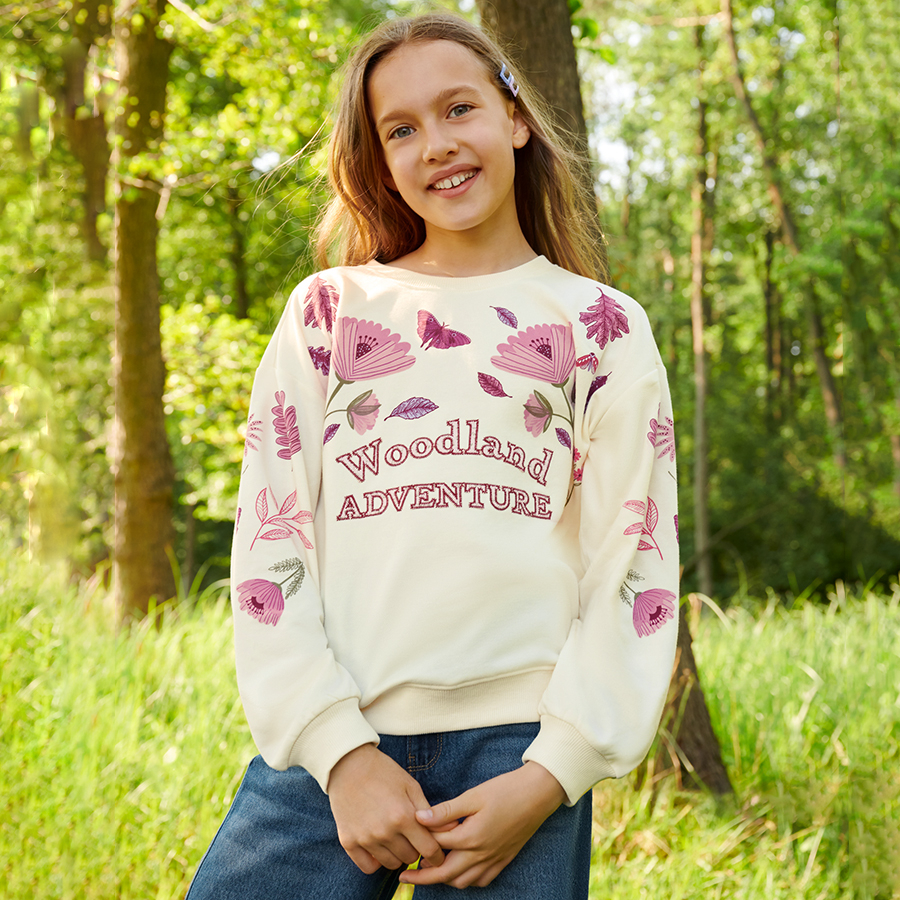 White sweatshirt with red flowers and Woodland Adventure print