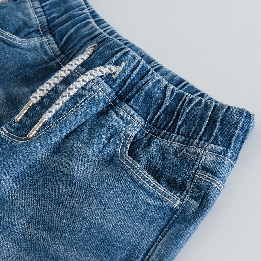 Denim trousers with adjustable waist