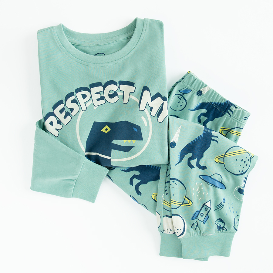 Light blue long sleeve and pants pyjamas with dinosaur print