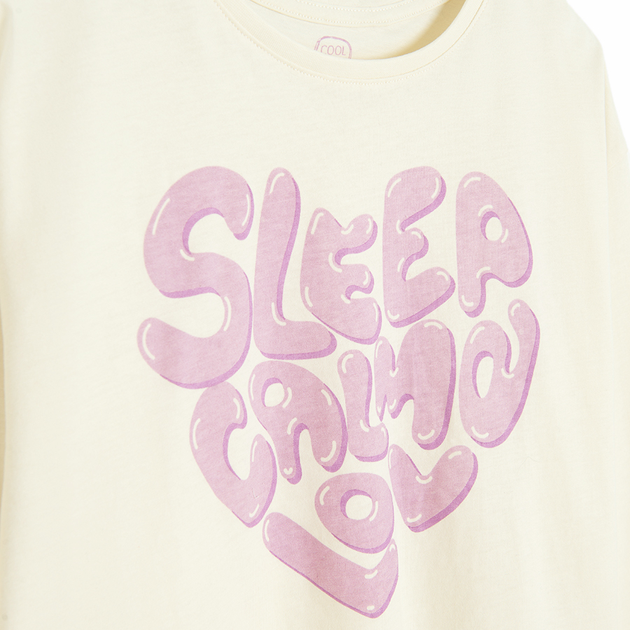 White long sleeve blouse with SLEEP CALM LOVE pring and pink pants with hearts pyjamas