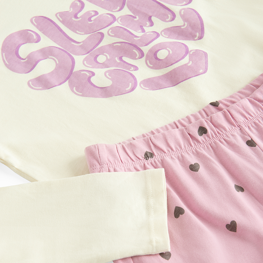 White long sleeve blouse with SLEEP CALM LOVE pring and pink pants with hearts pyjamas