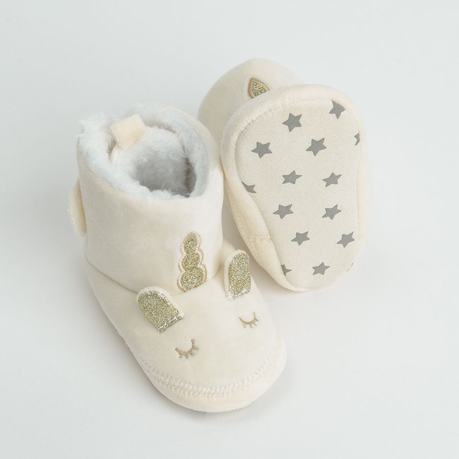 White newborn slippers with gold unicorn print