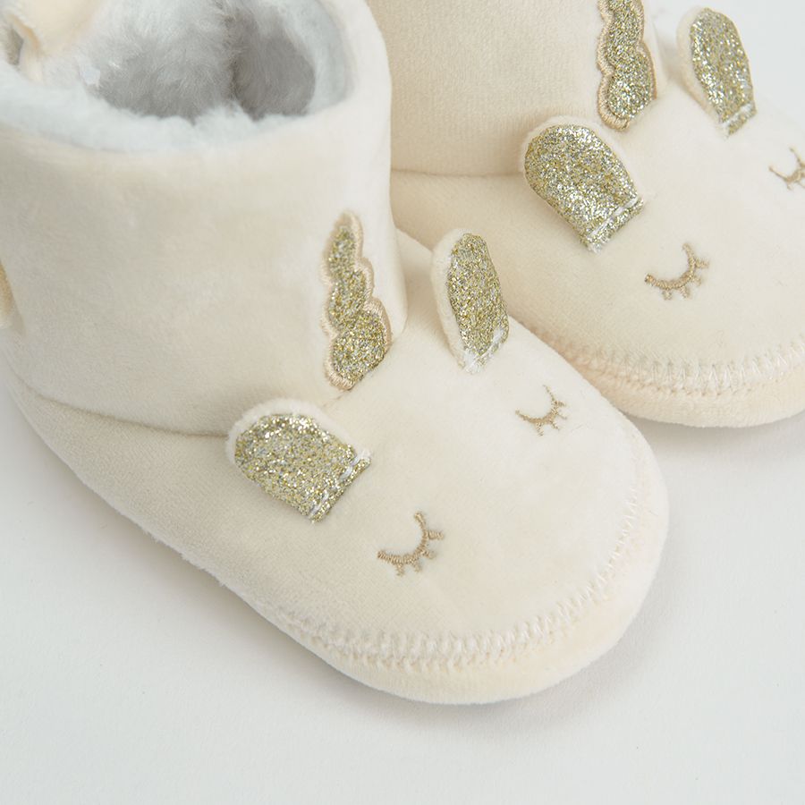 White newborn slippers with gold unicorn print